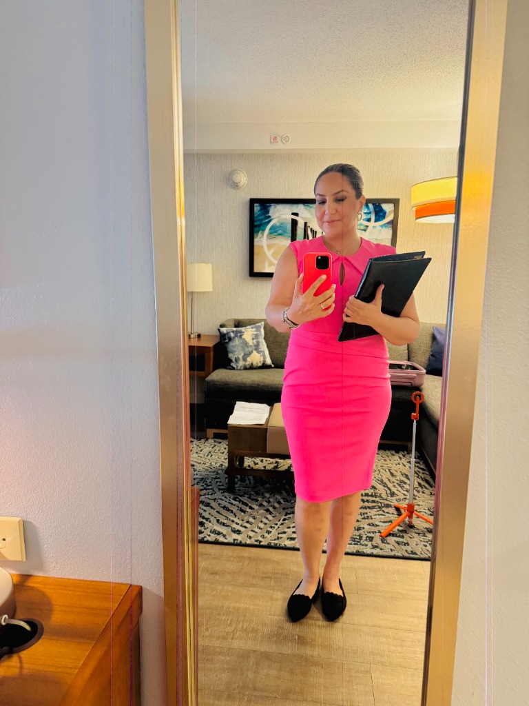 Elmira Jafari in bright pink dress ready for Nikki and Sam wedding rehearsal day