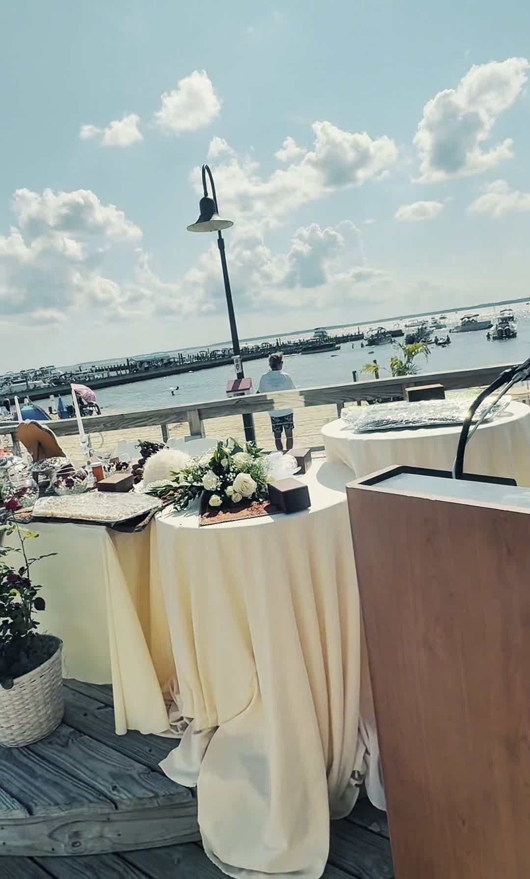 Nikki and Sam's outdoor waterfront Sofreh Aghd setup overlooking the marina