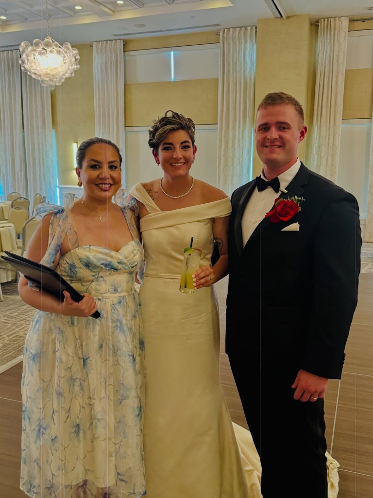 Elmira Jafari with the bride and groom at their wedding celebration